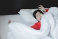 Nightmare or bad dream,Woman with scare and panic while lying down under the blanket in bedroom Royalty Free Stock Photo