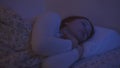 nightmarish dreams, a woman sleeps restlessly