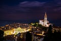 Nightscape of Piran, Slovenia with big dominant St. George`s Parish Church and main square