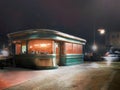 Nightshot of An American Retro Vintage 1950s Diner Cafe with city background