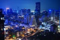 Nighttime in Bangkok city at night in Thailand. Aerial view of cityscape. Modern buildings, urban architecture and road traffic Royalty Free Stock Photo