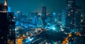 Nighttime in Bangkok city at night in Thailand. Aerial view of cityscape. Modern buildings, urban architecture and road traffic Royalty Free Stock Photo