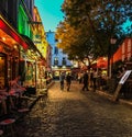 Nighttime on a busy Montmartre street on the Place du Tertre, Paris, France Royalty Free Stock Photo