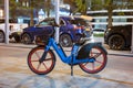 Nighttime City Life: Blue Electric Rental Bike