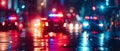 Nighttime city street with police car siren lights flashing creating a bokeh effect No identifiable Royalty Free Stock Photo