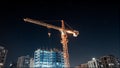 Nighttime Construction Site with Illuminated Crane Royalty Free Stock Photo