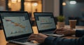 Nighttime Data Analysis: Two Laptops, Gantt Charts, & Business Insights Royalty Free Stock Photo