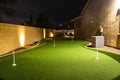 Nighttime image of a personal home putting green