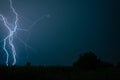 Spectacular blue lightning strike at night