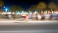 Nighttime rush hour blurred motion, illuminated city life, commuting men generated by AI Royalty Free Stock Photo