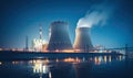 Nighttime Silhouette of Twin Cooling Towers Reflected in Calm Water Royalty Free Stock Photo