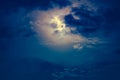 Nighttime sky with clouds and bright full moon with shiny. Royalty Free Stock Photo