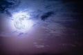 Nighttime sky with clouds and bright full moon with shiny. Royalty Free Stock Photo
