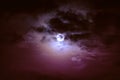 Nighttime sky with clouds and bright full moon with shiny. Royalty Free Stock Photo