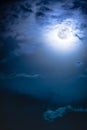 Nighttime sky with clouds and bright full moon with shiny. Royalty Free Stock Photo