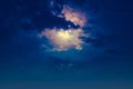 Nighttime sky with clouds and bright full moon with shiny. Royalty Free Stock Photo