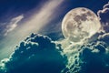 Nighttime sky with clouds and bright full moon with shiny. Cros Royalty Free Stock Photo