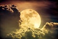 Nighttime sky with clouds and bright full moon with shiny. Sepi Royalty Free Stock Photo