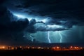 Nighttime storm illuminated by a dramatic and powerful lightning strike Royalty Free Stock Photo