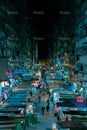 Nighttime street scene featuring a bustling urban environment