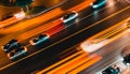 Nighttime traffic rush ignites city streets with blurred light trails generated by AI