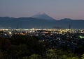 Nighttime view of Kofu city with Mount Fuji on the background