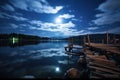 nighttime view of a lake with rods on the dock under bright moonlight Royalty Free Stock Photo