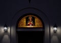 Stained glass window featuring Jesus Christ above the entrance to Saint Mary`s Catholic Church in Marfa, Texas. Royalty Free Stock Photo