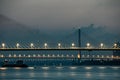 Nighttime view of a Wuhan Yangtze River Second Bridge with lights on in the early morning.