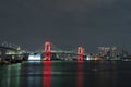 Nightview of Rainbow Bridge, illuminated in red as a sign of coronavirus alert Royalty Free Stock Photo