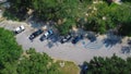 Nighty degree aerial view trucks and SUV cars at parking lot surrounding large trees at Jackson County Rest Area West near Highway Royalty Free Stock Photo