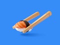 Nigiri. Japanese cuisine. Chopsticks holding sushi roll with salmon on blue background. Concept of susi, sushi