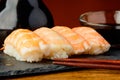 Nigiri sushi with prawns and soy sauce