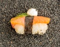 Nigiri Sushi with Salmon and Seaweed Nori on Dark Background Royalty Free Stock Photo