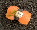 Nigiri Sushi with Salmon and Seaweed Nori on Dark Background Royalty Free Stock Photo