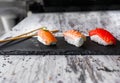 Nigiri sushi set, close-up. Fresh salmon, white fish, and shrimp on rice Royalty Free Stock Photo