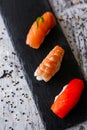 Nigiri sushi set, close-up. Fresh salmon, white fish, and shrimp on rice Royalty Free Stock Photo