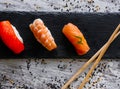 Nigiri sushi set, close-up. Fresh salmon, white fish, and shrimp on rice Royalty Free Stock Photo