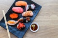 Nigiri Sushi set with salmon, grouper, eel, tuna and prawn on clay plates Royalty Free Stock Photo