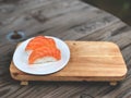 Nigiri Sushi in white dish on the wooden tray and wooden background with natural light. Royalty Free Stock Photo