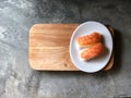 Nigiri Sushi in white dish on the wooden tray and cement floor natural dark light. Royalty Free Stock Photo