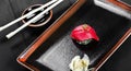 Nigiri with tuna on dark wooden background. Gunkan Sushi set. Japanese cuisine. Top view. Royalty Free Stock Photo