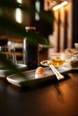 Nigiri tuna tataki on a plate on a table in a sushi bar.