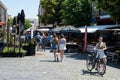 Nijmegen, Gelderland, The Netherlands - People and a cyclist walking in the main shopping street in old town