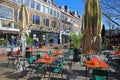 View on pedestrian shopping street with people on sunny winter day