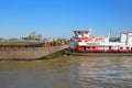 View on HGK pusher boat herkules vessel with cargo barge on river waal against blue sky Royalty Free Stock Photo