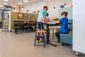 NIJMEGEN / NETHERLANDS-SEPTEMBER 13, 2019: Modern school building for children up to 12 years old. The children are busy carrying