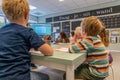 NIJMEGEN / NETHERLANDS-SEPTEMBER 13, 2019: Modern school building for children up to 12 years old. The children are busy carrying