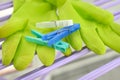 Cloth pegs on household gloves placed on a drying rack Royalty Free Stock Photo