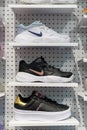 Nike and Adidas sneakers on sports store shelf. Minsk, Belarus - January 21, 2024